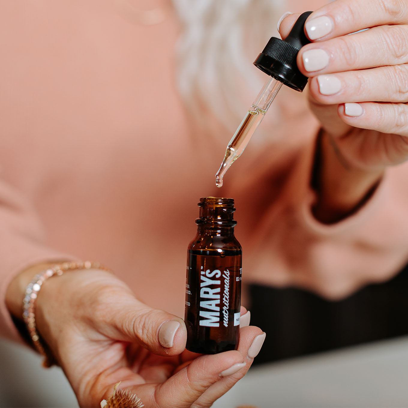 Woman holding Mary's Nutrtionals Remedy Tincture