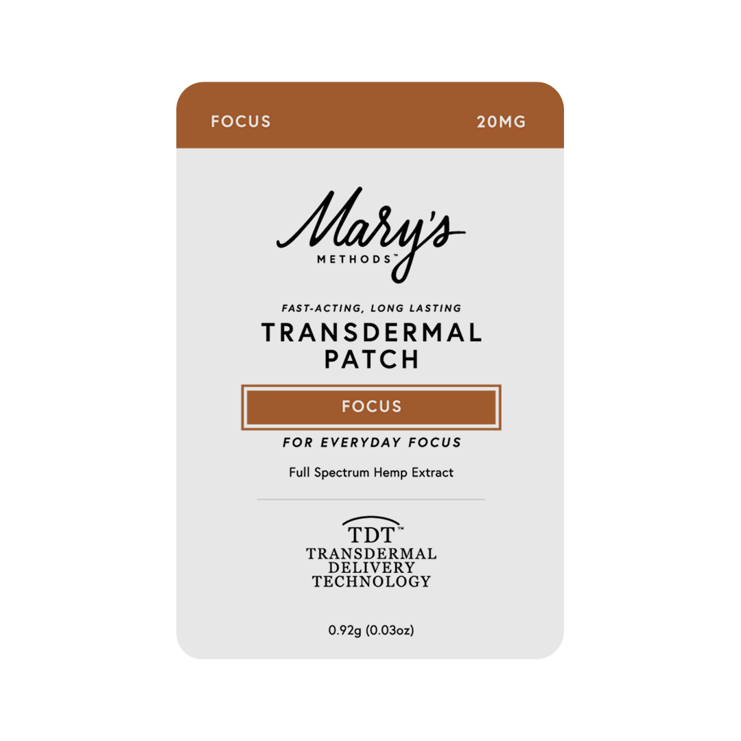 A single Mary's Methods Focus 20mg transdermal patch package on a plain white background. The rectangular card-style box has rounded corners, a white main field, and brown blocks at the top and around the 'Focus' label.